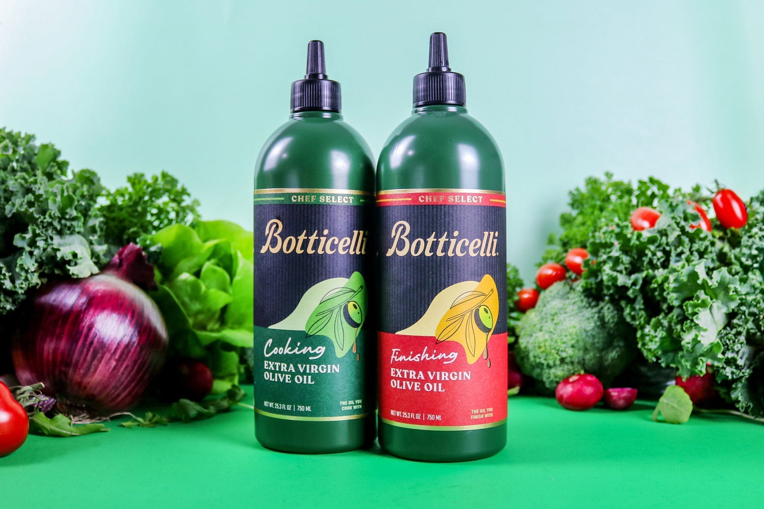 Botticelli Chef Select Cooking and Finishing Extra Virgin Olive Oils placed in front of a bunch of vegetables