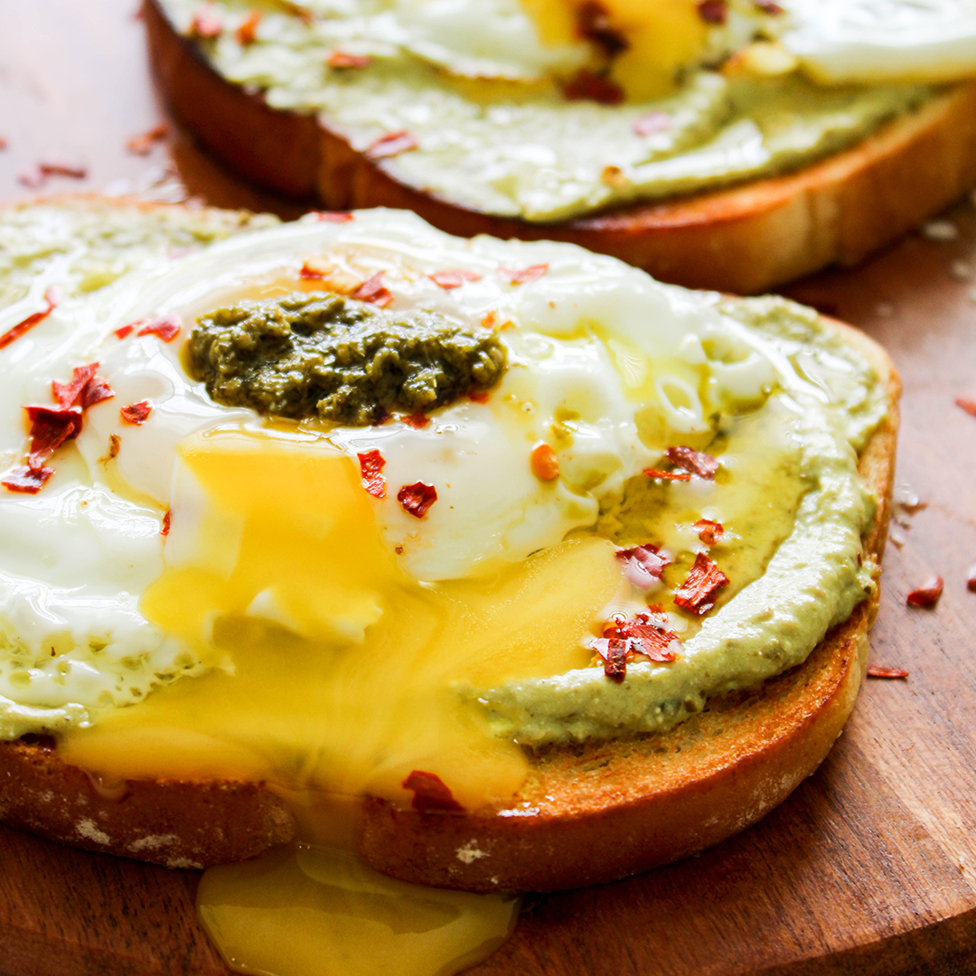 whipped pesto toast with a fried egg