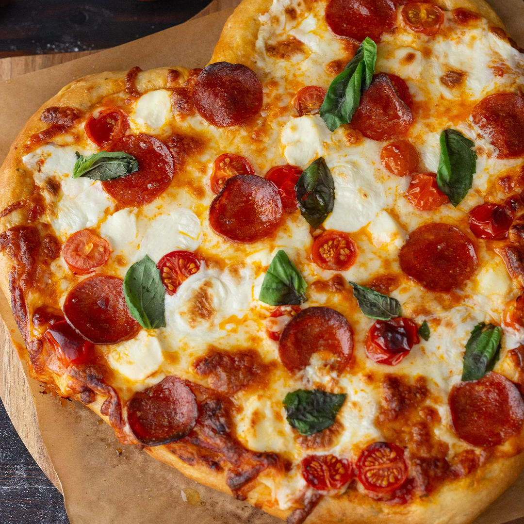heart shaped pizza with pepperoni