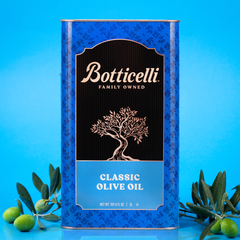 Botticelli olive oil canister with olives on a blue background