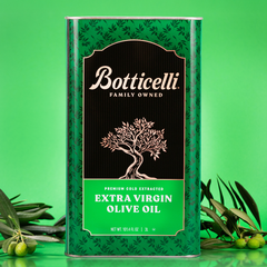Botticelli olive oil can with green leaves on a green background