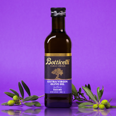 Bottle of Botticelli Baking extra virgin olive oil with olive branches on a purple background