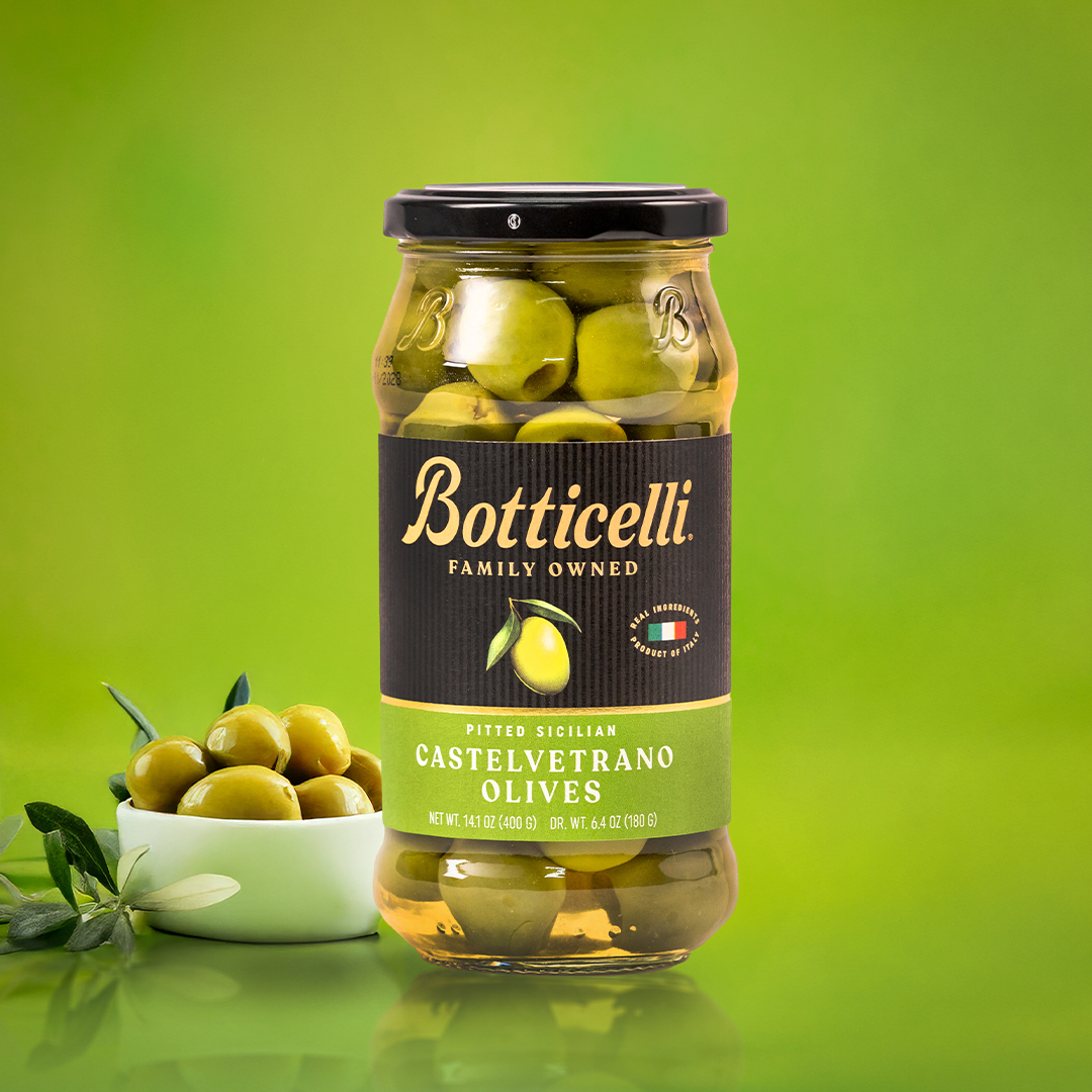 Botticelli Castelvetrano Olives packaging on a green background
