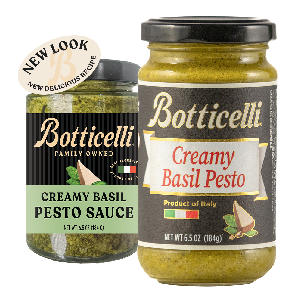 Two jars of Botticelli Creamy Basil Pesto Sauce on a white background, one showing the new look, and the other showing the old label. A beige circular sticker reading 'NEW LOOK NEW DELICIOUS RECIPE' is attached near the top left of the newly labeled product.