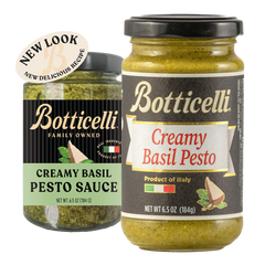 Two jars of Botticelli Creamy Basil Pesto Sauce on a white background, one showing the new look, and the other showing the old label. A beige circular sticker reading 'NEW LOOK NEW DELICIOUS RECIPE' is attached near the top left of the newly labeled product.