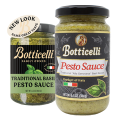 Two glass jars of Botticelli Traditional Basil Pesto Sauce on a white background, one with the old label, and the other with the new label. A beige circular sticker reading 'NEW LOOK NEW DELICIOUS RECIPE' is attached near the top left of the newly labeled product.